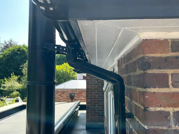 New black guttering and downpipe